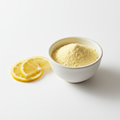 Organic Lemon Peel Powder in a white ceramic bowl with fresh lemon slices – Roots 4 Ever